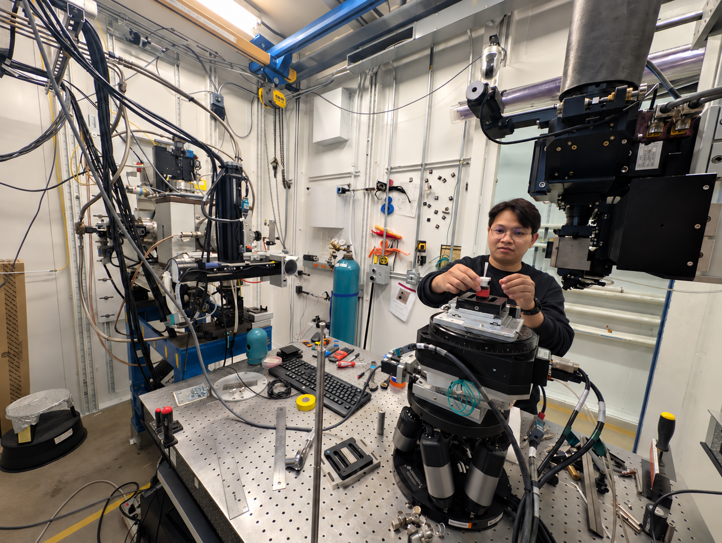 Worasit preparing a soil aggregate sample for X-ray microCT imaging at the Advanced Photon Source