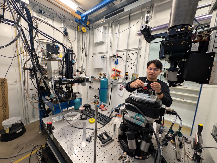 Worasit preparing a soil aggregate sample for X-ray microCT imaging at the Advanced Photon Source