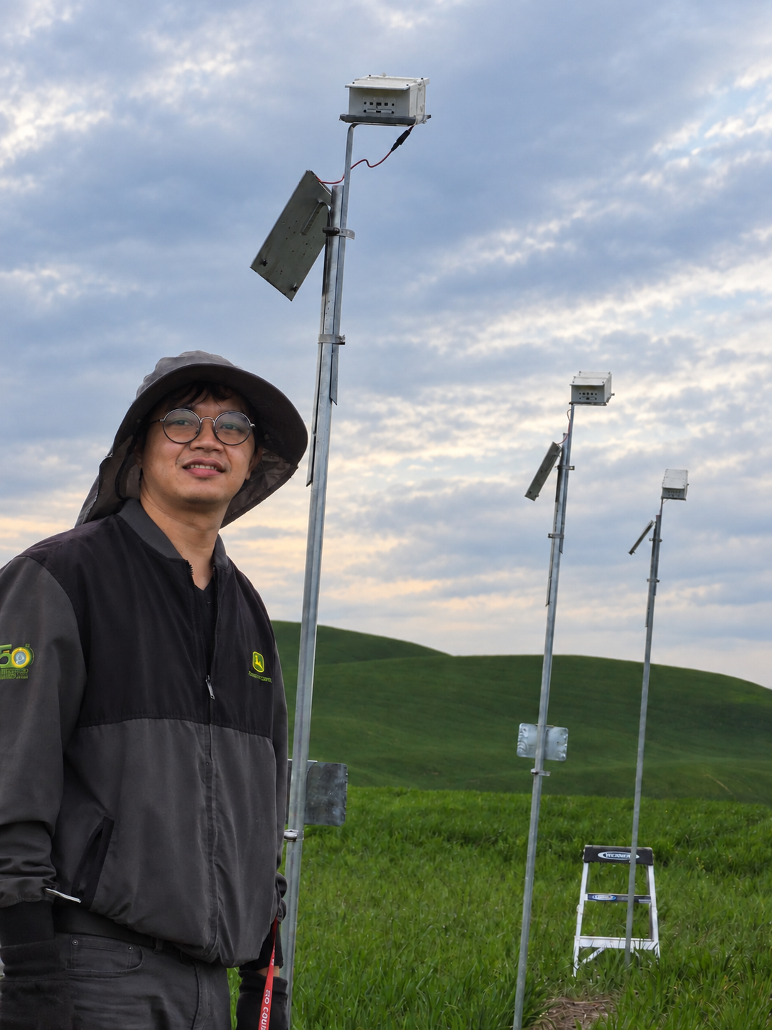 Worasit beside automated field cameras in wheat trials